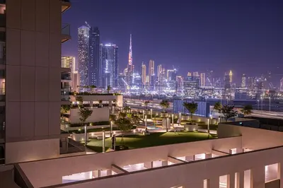 a view of a city skyline at night at Burj Khalifa & Downtown Skyline View Apartment in Dubai