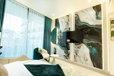 a bedroom with a large painting on the wall at Binghatti Aurora, JVC Dubai - Unique Round Bed Experience with pool view in Dubai