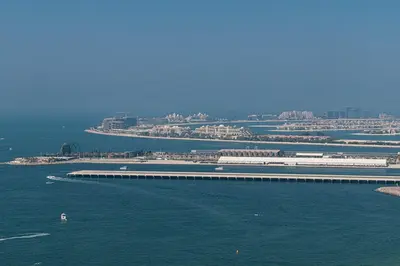 an aerial view of a pier in the water at Beachfront Spacious Apartment with Sea & Palm Views in Dubai