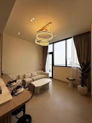a living room with a couch and a table at Modern1BR Binghatti Phantom Private pool JVC in Dubai