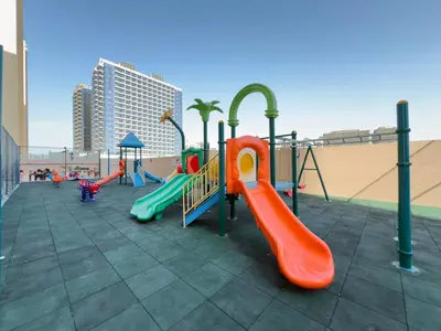 a playground with a slide and slidesktop at Amazing View Studio Lago Vista IMPZ in Dubai
