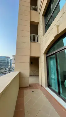 a building with a large window and a balcony at Luxury 1-Bedroom, Golden Mile Palm Jumeirah in Dubai
