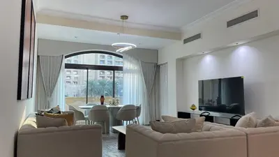 a living room with two couches and a dining room at Luxury 1-Bedroom, Golden Mile Palm Jumeirah in Dubai