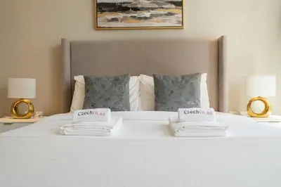 a large white bed with two pillows on it at Luxury Studio at Marina Star - Near JBR - Marina in Dubai