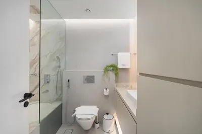 a bathroom with a toilet and a shower and a sink at Luxury Studio at Marina Star - Near JBR - Marina in Dubai