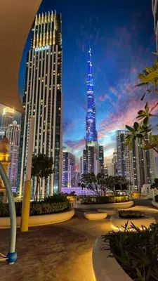 a view of a city skyline with a tall building at Ultra-Luxury Apartment | Burj Khalifa Skyline Pool in Dubai