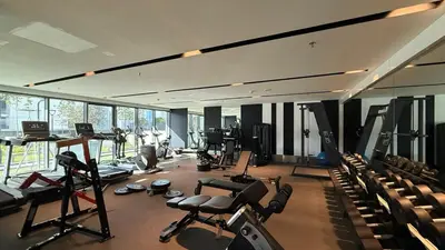 a gym with a lot of equipment in a room at 2 bedroom in heart of Business Bay - Dubai in Dubai