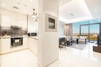 a kitchen and dining room with a view of the city at 2 bedroom in heart of Business Bay - Dubai in Dubai