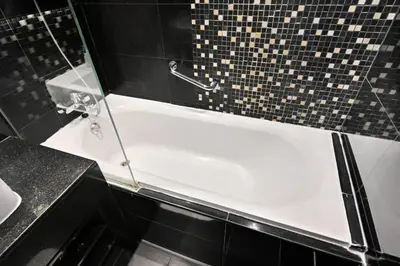 a bathroom with a bath tub with a shower at Bloomfields Luxury 1BR, Damac Voleo, Business Bay in Dubai