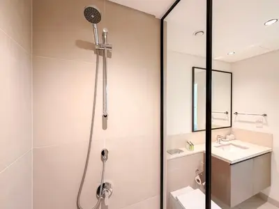 a bathroom with a shower and a sink at Burj Crown 3BR Skyline Retreat with Balcony in Dubai