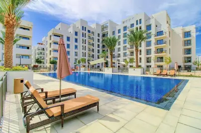 an image of a swimming pool at a resort at Silk Valley - Luxury Studio with Pool View - Walk to Park in Dubai
