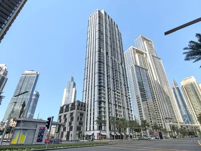 a tall building in a city with tall buildings at Breathtaking 1 BDR w Partial Burjkhalifa View in Dubai