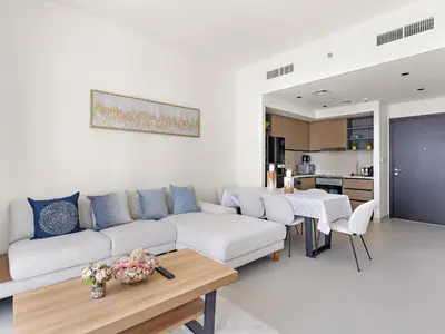 a living room with a couch and a table at Breathtaking 1 BDR w Partial Burjkhalifa View in Dubai