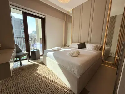 a bedroom with a large bed and a large window at Luxury 2BR in Creek Beach with Lagoon Access in Dubai