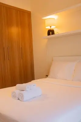 a bedroom with two towels on a bed at Cosy Modern Studio Downtown Dubai in Dubai