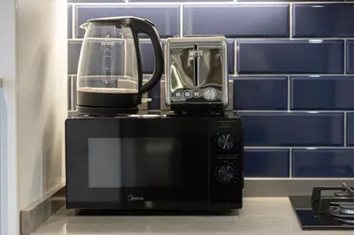a blender sitting on top of a kitchen counter at Luxury Canal View Studio for 4 Guests in Downtown, 5 Min to Dubai Mall in Dubai