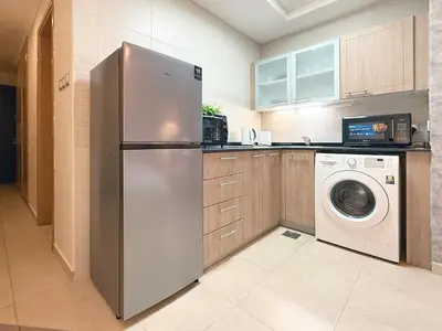 a kitchen with a refrigerator and a washing machine at Studio in Dubai Marina near by Beach & Metro Z1409 in Dubai