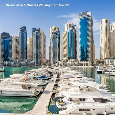 a group of boats docked in a marina with tall buildings at Studio - Dubai Marina - Partial Marina View Z1104 in Dubai