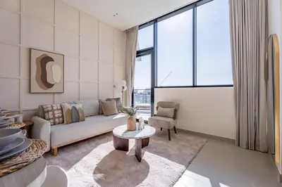 a living room with a couch and a table at GuestReady - Luxe Stay with Private Pool in Dubai