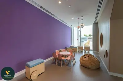 a dining room with purple walls and a table and chairs at Vogue Downtown Views II with Direct Access to Dubai Mall Via a Climate Controlled Bridge, One Bedroom Apartment with Balcony and City View in Dubai