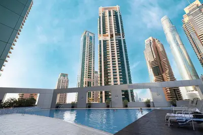 a pool in a city with tall buildings at Marina Escape Spacious Skyview 2BR in Dubai