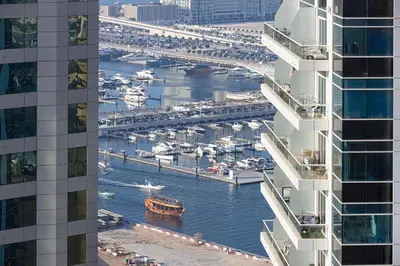 a view of a marina between two buildings at Marina Escape Spacious Skyview 2BR in Dubai