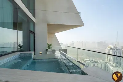 a swimming pool on the side of a building at Vogue JVC Binghatti Phantom near Circle Mall, One Bedroom Apartment with a Private Pool in Balcony and full Access to all Amenities in Dubai