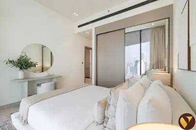 a bedroom with a white bed and a large window at Vogue JVC Binghatti Phantom near Circle Mall, One Bedroom Apartment with a Private Pool in Balcony and full Access to all Amenities in Dubai