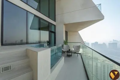 a balcony of a building with a view of the city at Vogue JVC Binghatti Phantom near Circle Mall, One Bedroom Apartment with a Private Pool in Balcony and full Access to all Amenities in Dubai