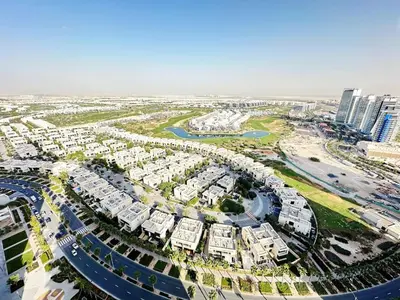 an aerial view of a city with buildings and roads at Cozy Studio Retreat in Damac Hills in Dubai
