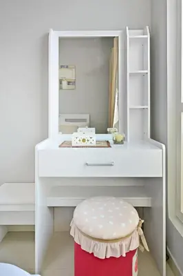 a white dressing table with a stool and a mirror at Lake Point Tower 1 BHK by Petals Holiday Homes in Dubai