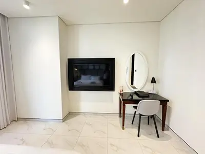 a room with a desk and a mirror and a table at Elegant 1BR in Business Bay in Dubai