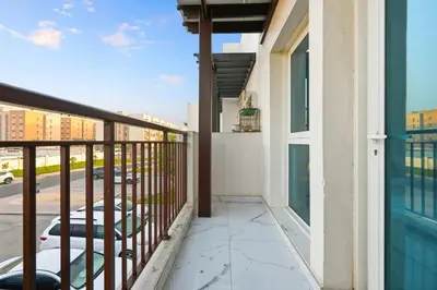 a balcony with a view of a parking lot at 5 BR Villa Near Business Bay By Petals Holiday Homes in Dubai
