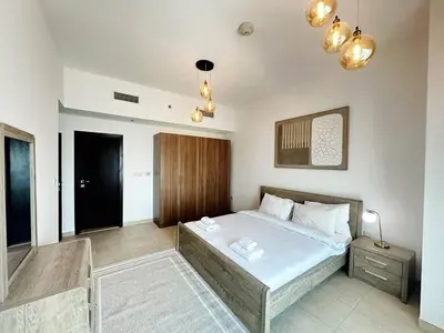 a bedroom with a large bed in a room at preatoni tower 1 BHK in JLT By petals Holiday Homes in Dubai
