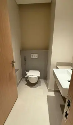 a bathroom with a toilet and a sink at Luxurious 2 Bedroom Apt in VDM Residences - Full Burj Khalifa View in Dubai
