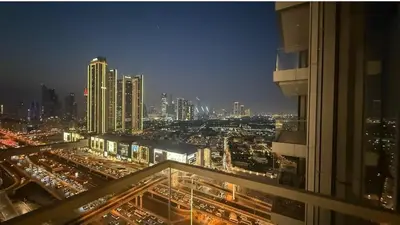 a view of a city at night from a building at Luxurious 2 Bedroom Apt in VDM Residences - Full Burj Khalifa View in Dubai