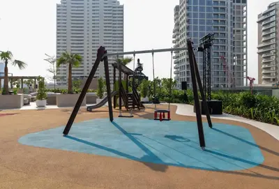 an empty playground in a city with tall buildings at Luxury 1BR in JVC Private Balcony Pool & Parking in Dubai