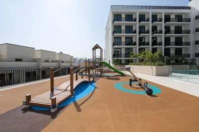 a playground on the roof of a building at Warm Modern 1BR Haven with Balcony & Free Parking in Dubai