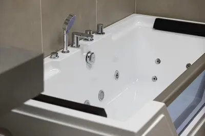 a white bath tub with a sink in a bathroom at 3BHK Near Beach High Floor Marina Stay DEC 1203 Tower 1 in Dubai