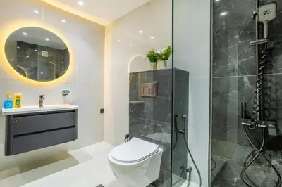 a bathroom with a toilet and a shower at Luxury 2BHK w Floating Bed in Dubai Marina DEC 1604 in Dubai