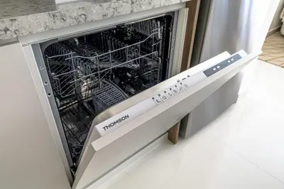 a dishwasher in a kitchen with its door open at Luxury one bed flat in Dubai Harbour in Dubai