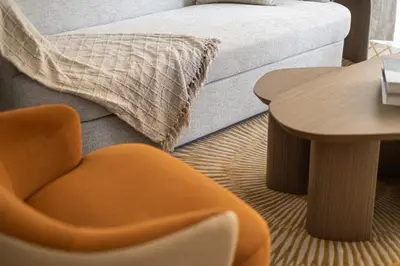 a room with a couch and a table and a chair at Luxury one bed flat in Dubai Harbour in Dubai