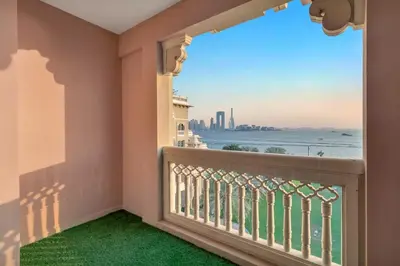 a balcony with a view of the ocean at 2BHK in Palm Jumeirah Sea View Grandeur Residence 301 in Dubai
