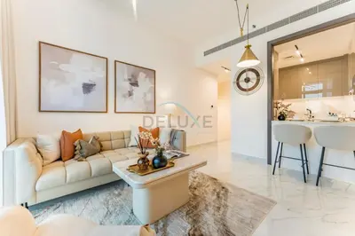 a living room with a couch and a table at Community View 1BR, Perfectly Located Near the Park, Just a Short Drive Away from Dubai Top Tourist Attractions, Adhara Star, Arjan by Deluxe Holiday Homes in Dubai