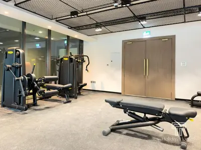 a gym with several treadmills and exercise bikes at Brand New 2 Bed Contemporary Apt-Gym Pool Access in Dubai