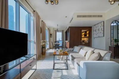 a living room with a couch and a tv at GlobalStay Luxury Apartments The Residences Tower 8 Downtown Dubai in Dubai