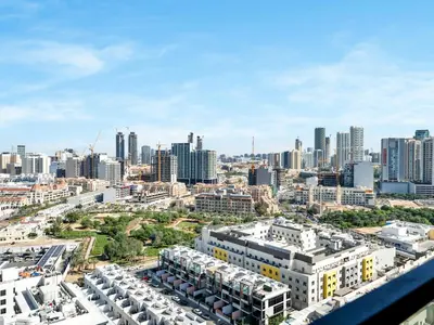 an aerial view of a city with tall buildings at Premium 2BD with Balcony Pool & Gym in Dubai