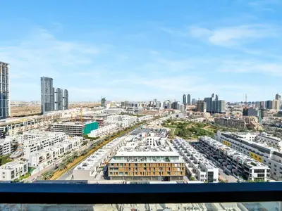 arial view of a city with buildings and roads at Premium 2BD with Balcony Pool & Gym in Dubai