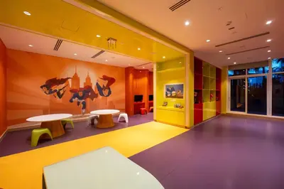 a room with two tables and a painting on the wall at Premium Studio Burj Khalifa & Canal View in Dubai
