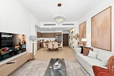 a living room with a couch and a table at Golden Stays - Burj View Downtown Near Dubai Mall Sleeps 11 in Dubai